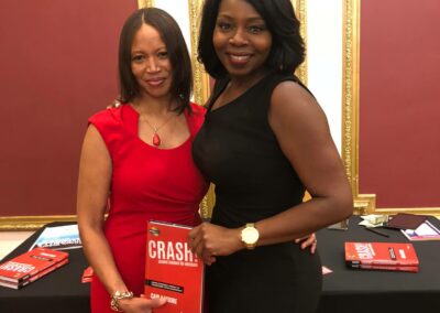 Carla Moore posing with fan at book sigining